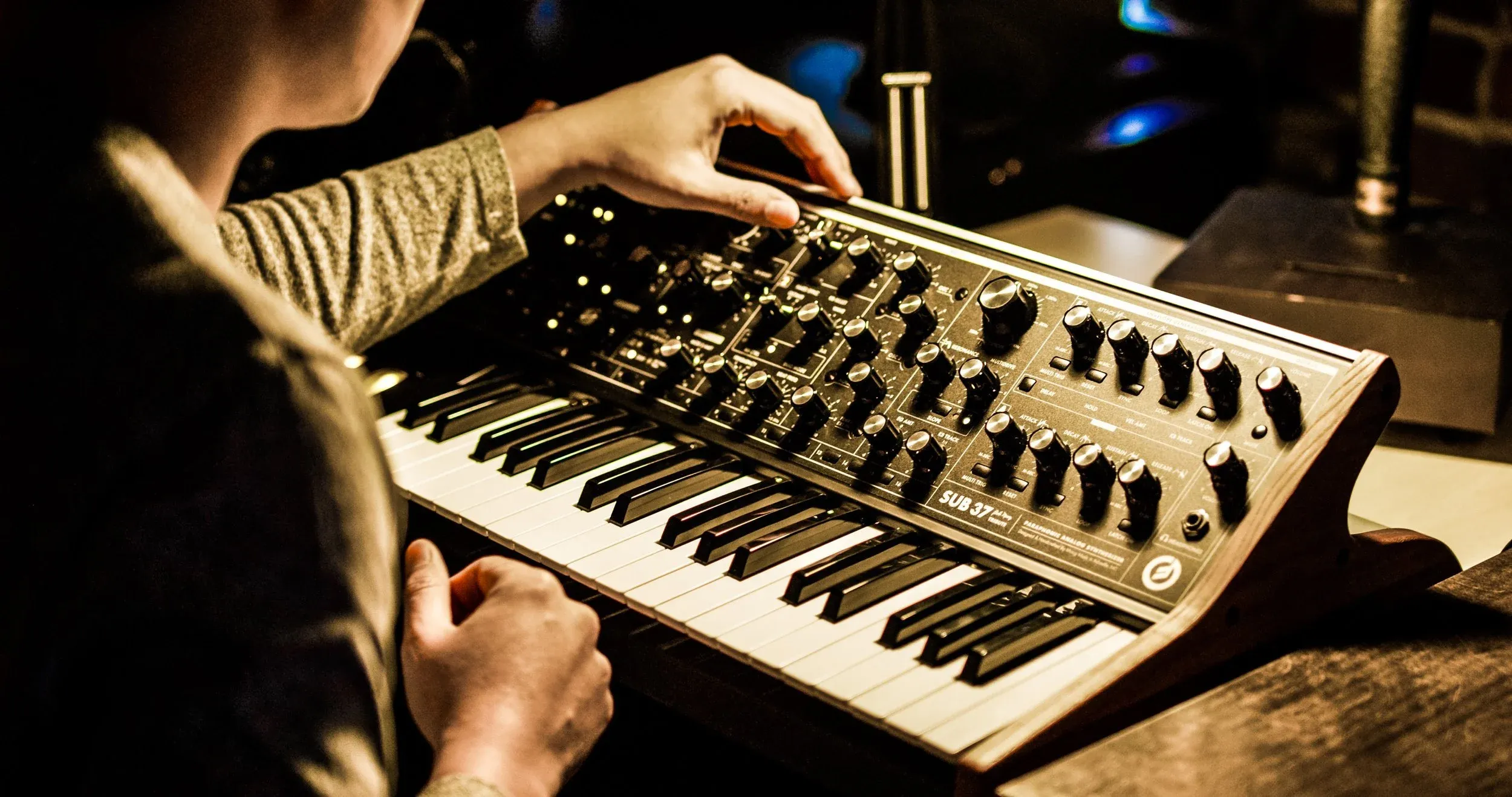 Hands on a synthesizer