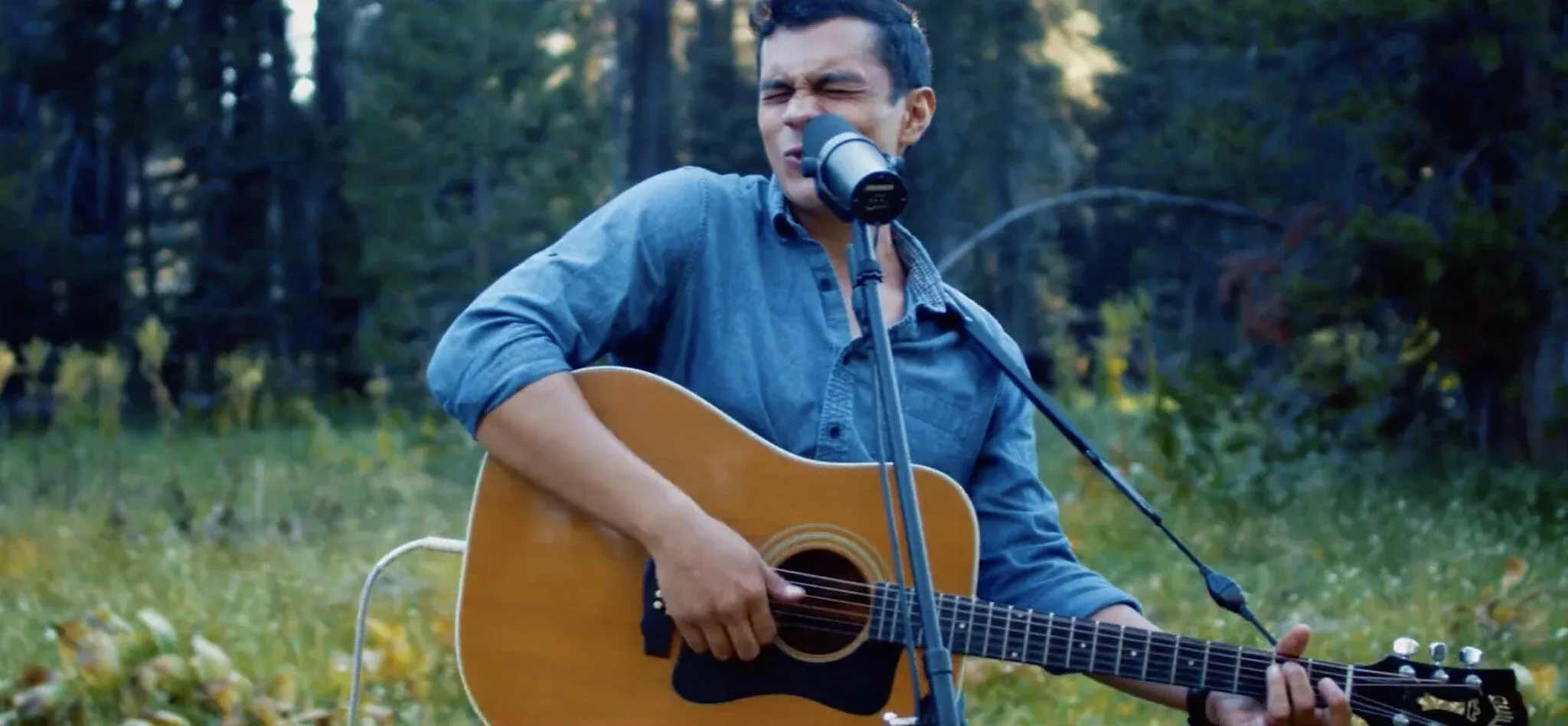 Andy Kong playing guitar in Yosemite, from Westfalia